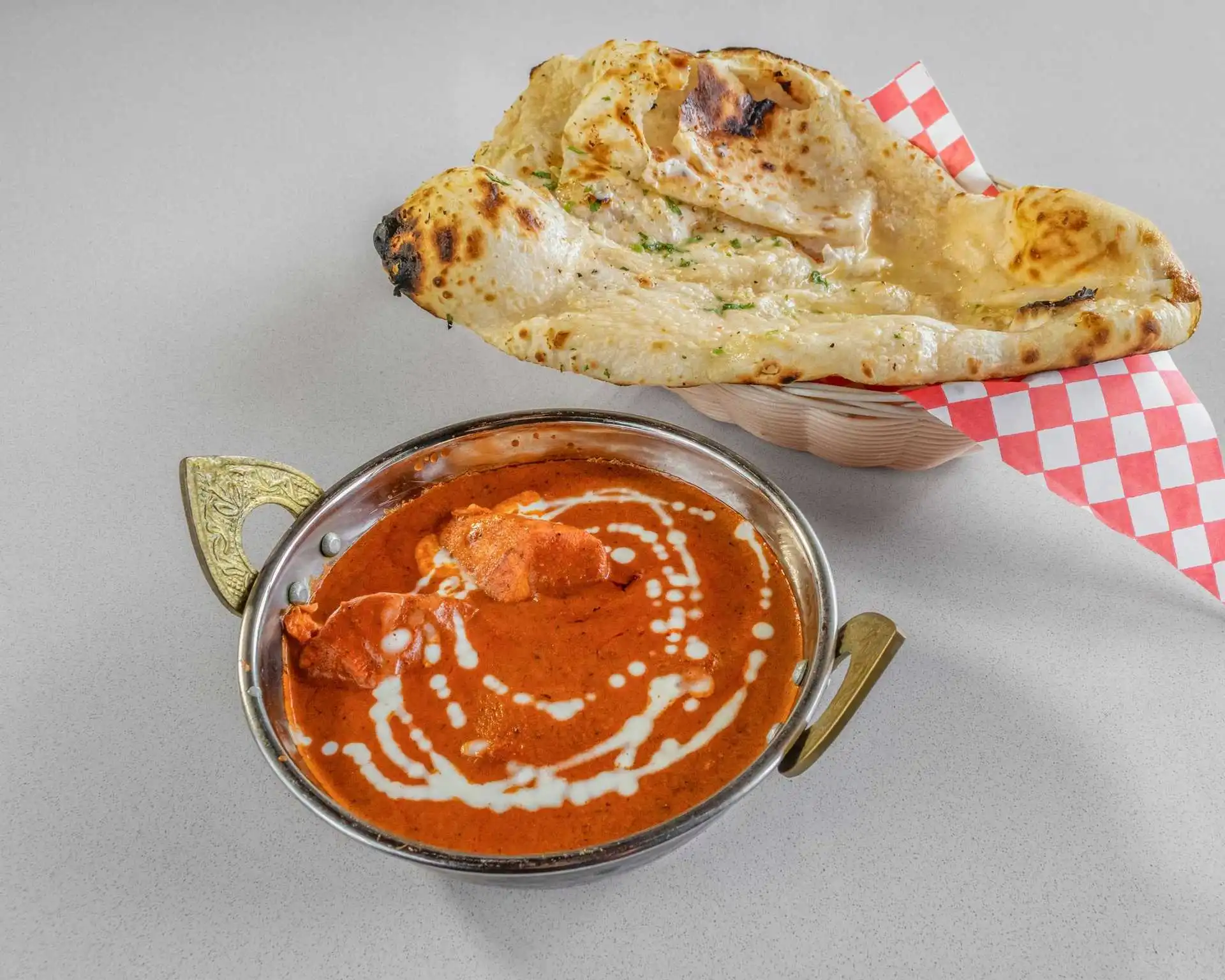 Latin combo platter with saucy main dish and bread at Pupuseria Rosa's London Ontario
